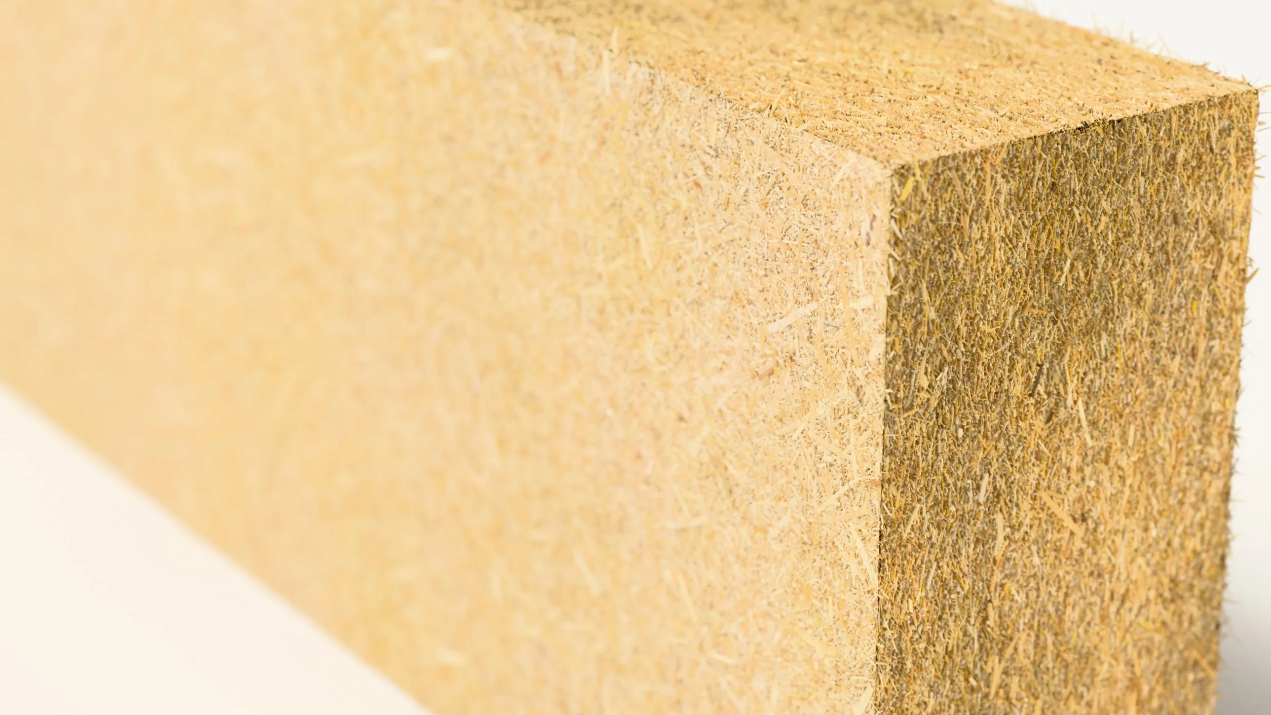 An EcoMur block close up, straw fibres in the surface